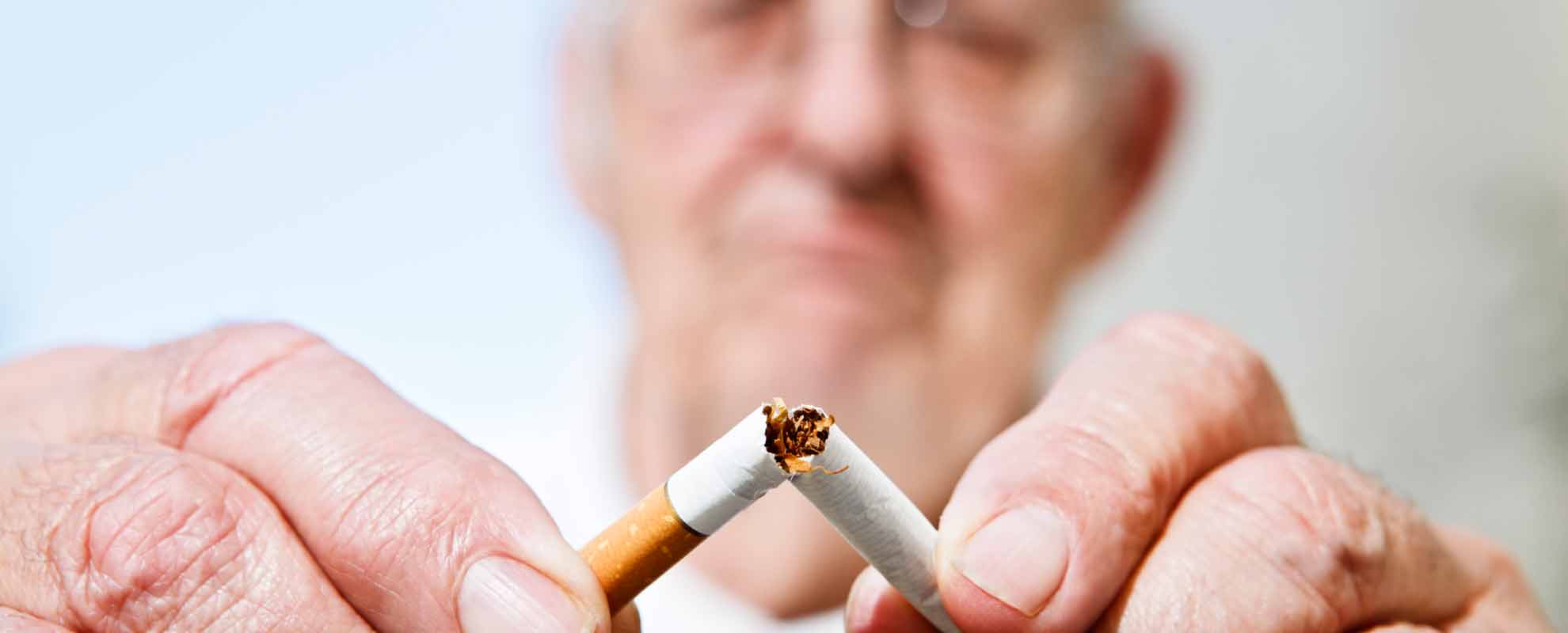 A cigarette being broken in two